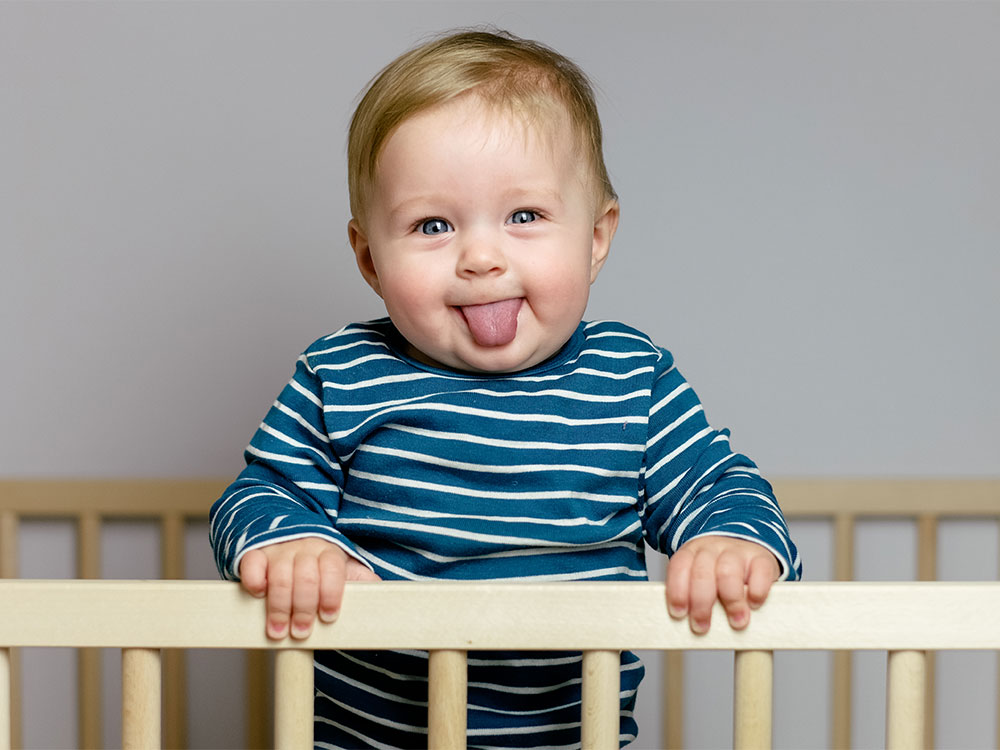 baby standing at 8 months