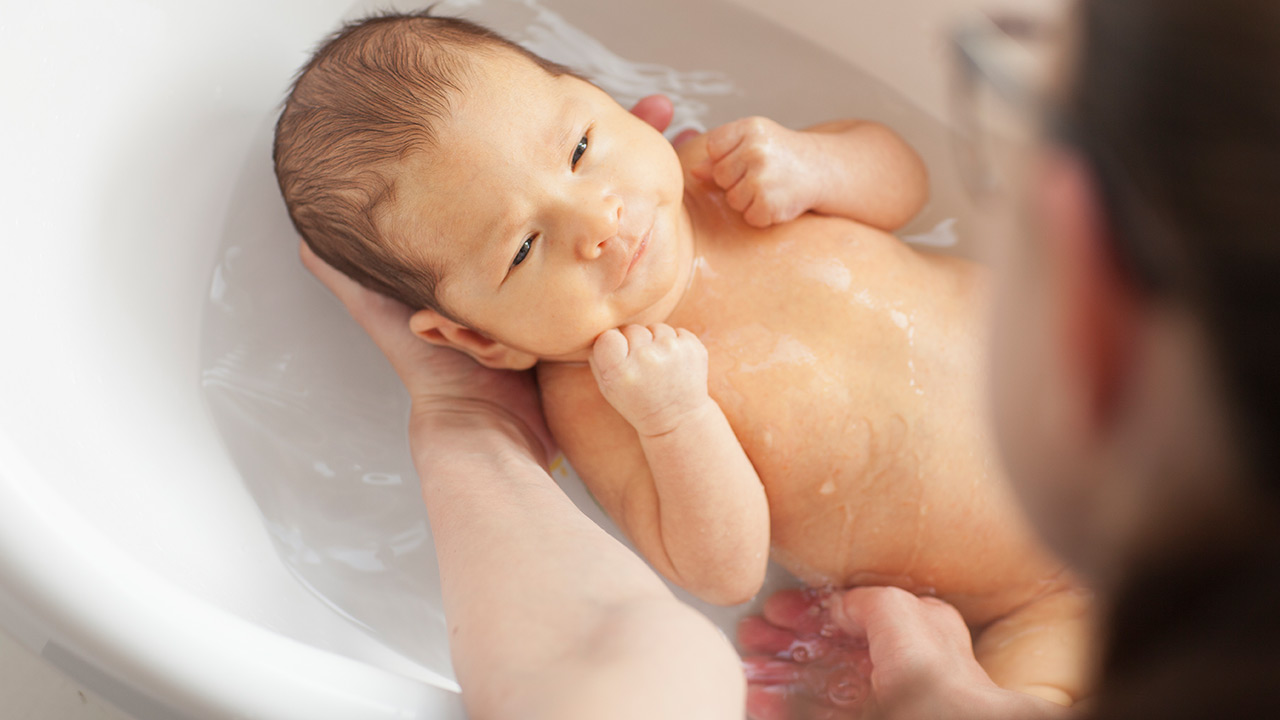 bathing a newborn baby boy