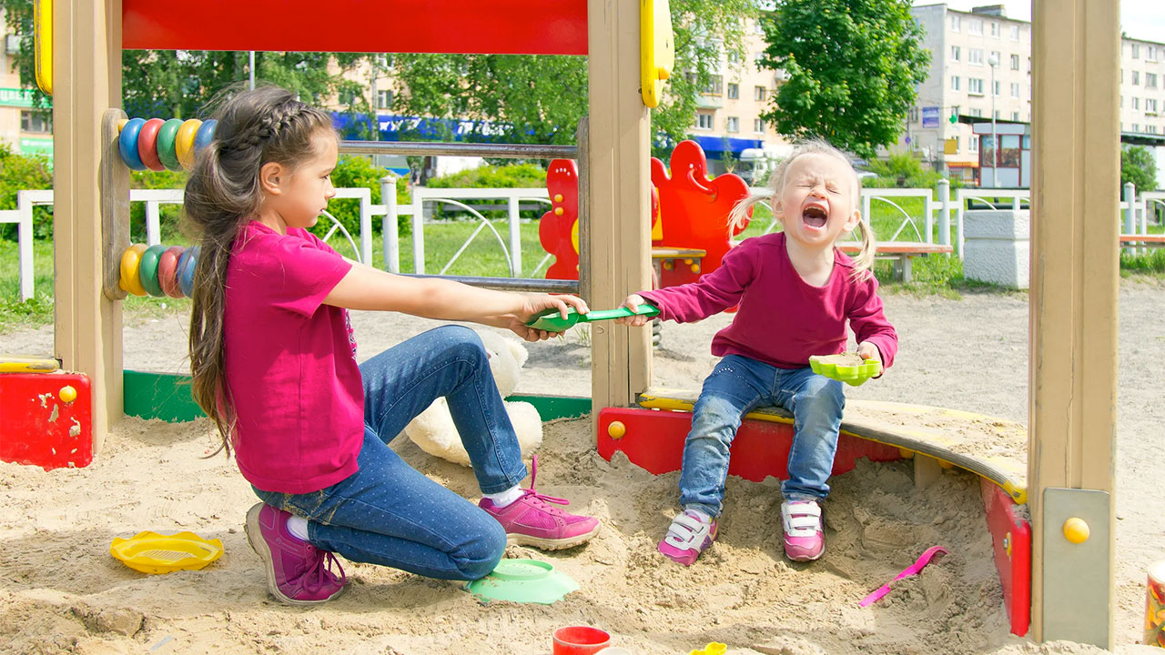 children fighting on playground