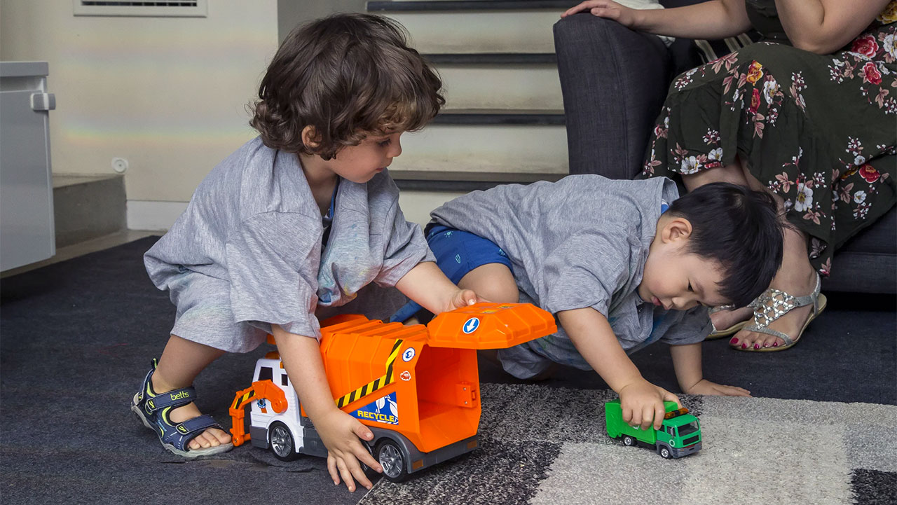 children sharing toys