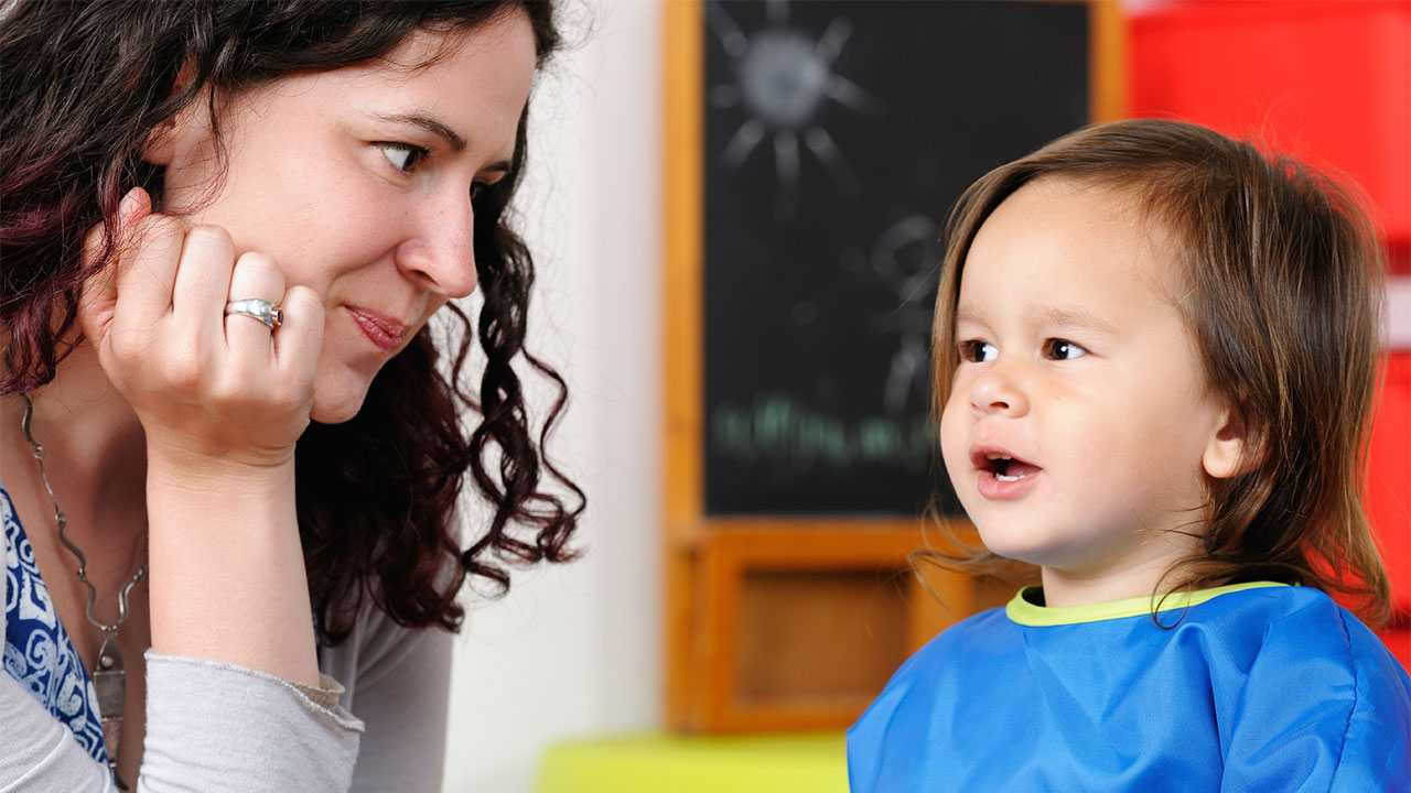 cute little girl with hearing problem try listening attentively by